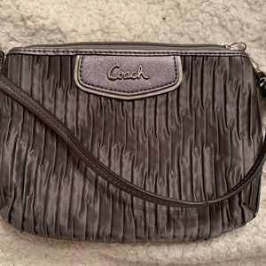 Authentic coach pouch with handle